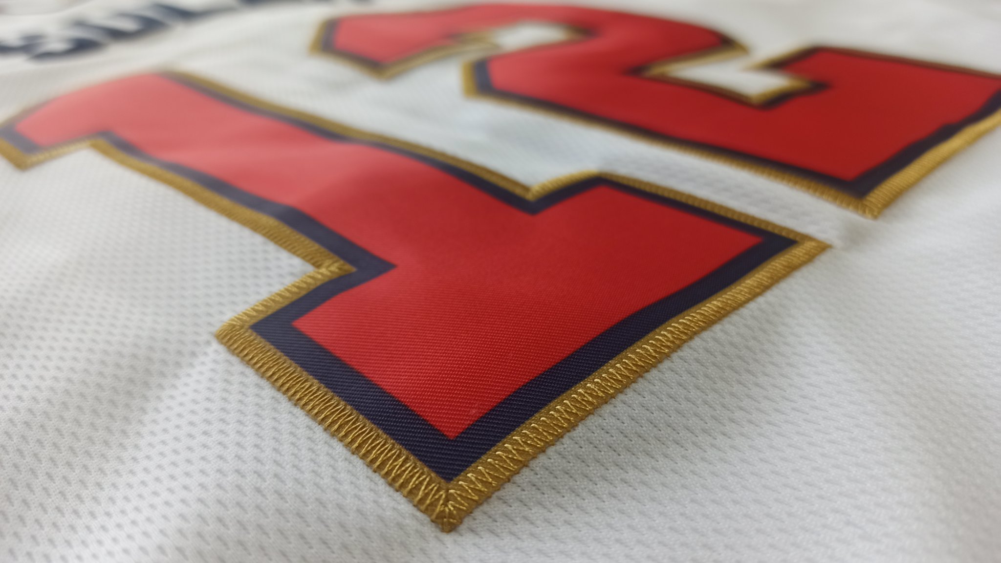 A detailed close-up of the premium tackle-twill stitching on a Ujersey